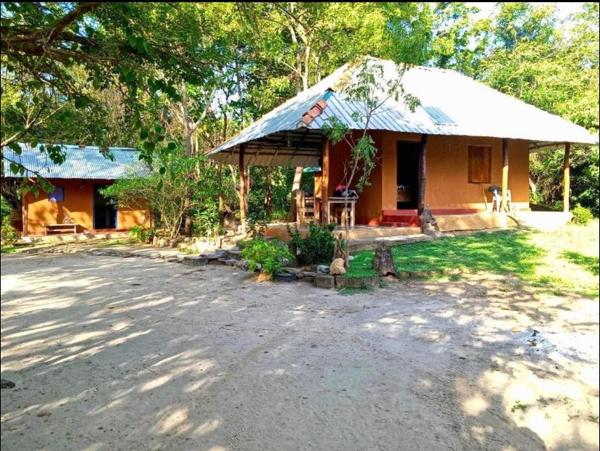 The bungalow and the separate bathroom building