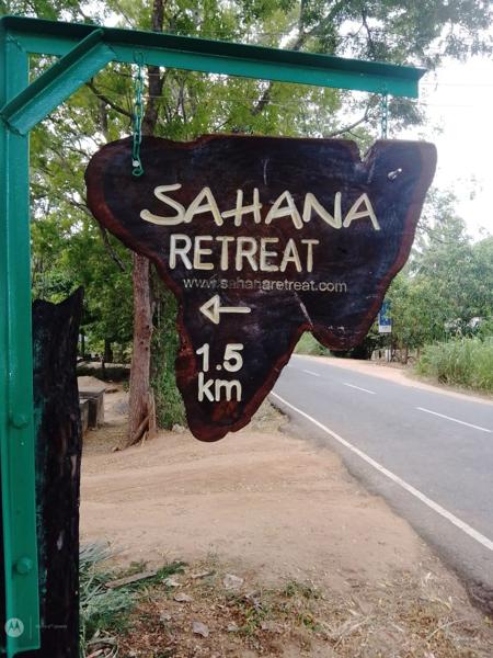 The Sahana Retreat sign by the road, 1.5 km